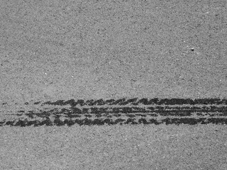 wet tire mark on asphalt road texture - 440883707