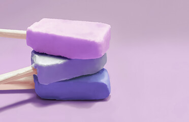 Bluberry, grape and acai popsicles on purple background
