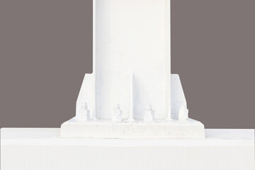 A large screw  hexagon flange nut at base of pillar, Metal pillar fastened to basement with anchor bolts nuts. Supporting structures, metal frame of prefabricated building. isolated on gray background