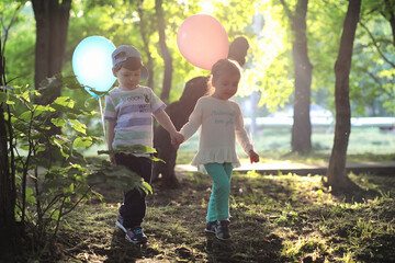 Little children are walking in a park