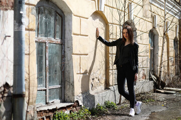 Girl on a walk through the spring city