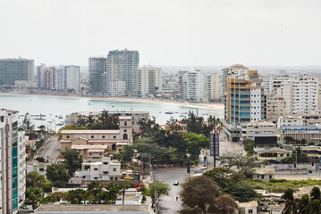 Obraz premium View of the boardwalk, the beach, buildings and streets of the coastal city. Horizontal photo.