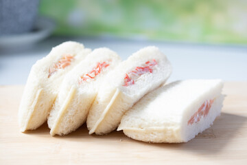 Crab Stick Sandwich on a Wooden Chopping Board