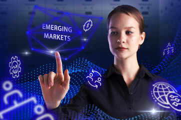 Business, Technology, Internet and network concept. Young businessman working on a virtual screen of the future and sees the inscription: Emerging markets