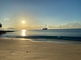 Sunrise on the white sand beach and blue water at summer vibes