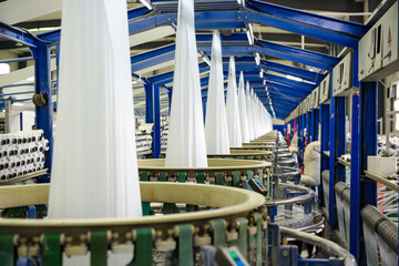 A packaging plant of woven bag workshop machinery is running, workers in the busy work.