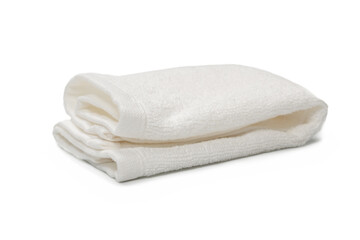 White fluffy cotton towel isolated on a white background.