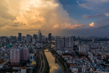 Sunset along the canal looking towards the city center of Saigon, Ho Chi Minh City, Vietnam