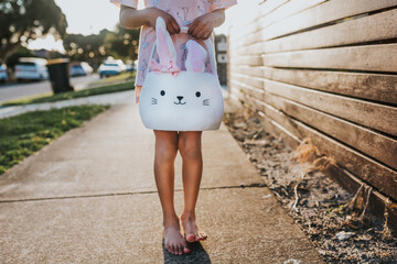 Little girl holding Easter bunny basket