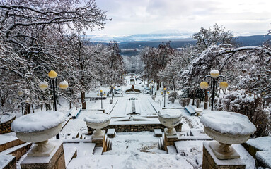 Snow-covered Cascade staircase of the park  of the resort  Zheleznovodsk, Russia.