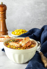 Hot spicy corn cream soup with bacon and shrimps. Seafood lunch a la chowder.