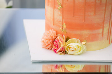 Beautiful small wedding cake decorated with flowers 