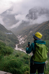 Fototapeta na wymiar The woman trekking on the way to Annapurna base camp.