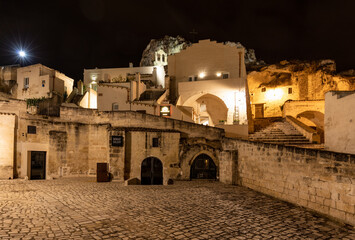 Fototapeta premium Night landscape of the Sassi of Matera a historic district iin the city of Matera well-known for their ancient cave dwellings. Basilicata. Italy