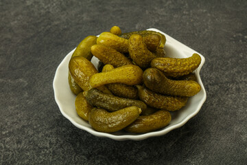 Pickled gherkin in the bowl