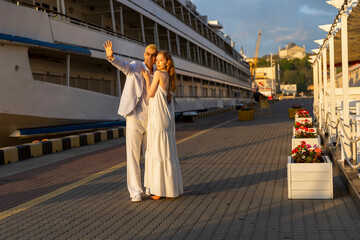 young couple walking in the seaport