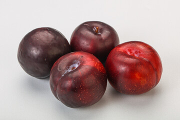 Ripe sweet plum fruit heap