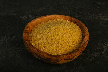 Raw cous cous heap in the bowl