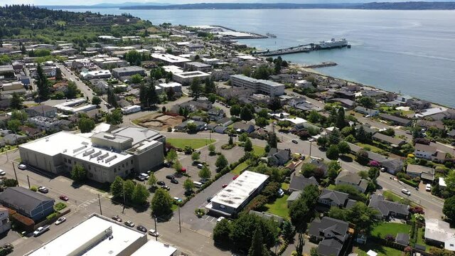 Cinematic 4K drone dolly clip of the downtown Edmonds commercial area, Kingston ferry terminal, Puget Sound waterfront marina near Seattle in Western Washington, Pacific Northwest, in Snohomish County