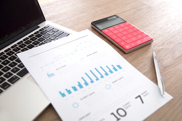 Documents and laptop and calculator on the table