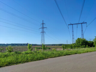 Road in the field under the power line