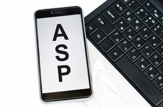 ASP or Application Service Provider text on phone screen on table near laptop