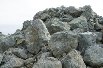 boulders on a construction site. photo during the day.