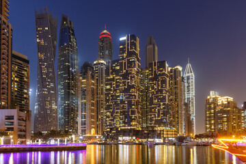 Dubai Marina skyline architecture buildings travel at night twilight in United Arab Emirates
