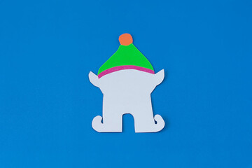 Step 5. Step-by-step instructions on how to make an elf out of colored paper and cardboard. DIY concept. Children's art project. Craft for children from colored paper for Christmas, St. Patrick's Day.