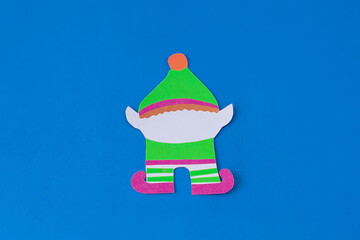 Step 10. Step-by-step instructions on how to make an elf out of colored paper and cardboard. DIY concept. Children's art project. Craft from colored paper for Christmas, St. Patrick's Day.
