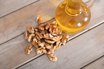 Walnut kernels and a bottle of walnut oil