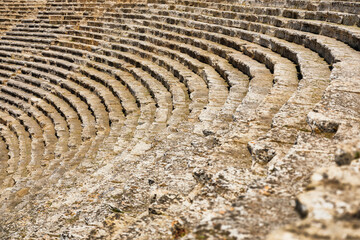 A staircase made of stone in an ancient theater. A composition without people. Ancient buildings and structures. Texture for background.