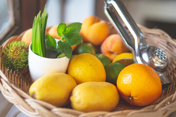 Select the focus. Yellow lemons in the fruit group in the basket.