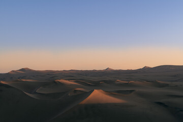 Fototapeta na wymiar Amazing dusk in the Ica desert. Peru, South America