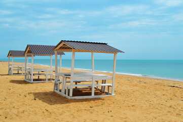 gazebo on a sunny beach, sea, sky