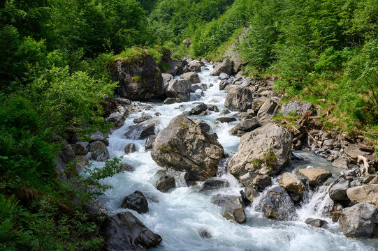 wild flowing Sandbach creek in Sandwald, Linthal Glarus