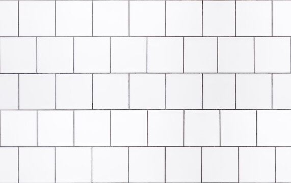 White tile background. Wall with white tiles for the interior of the kitchen or bathroom in the house. Decor, design and decoration of kitchen and bathroom interiors