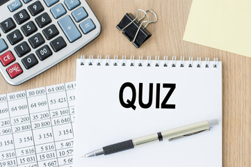 Quiz word written on white notepad on table, business concept