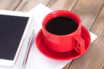 Coffee and tablet on the table