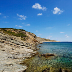 Obraz premium View of the wild south coast of the Greek island of Agatonissi the south coast between cape Gourna and cape Protali, in the Dodecanese archipelago