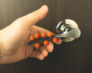 Viruses on the door handle. The concept of microbes sitting on the door handle.