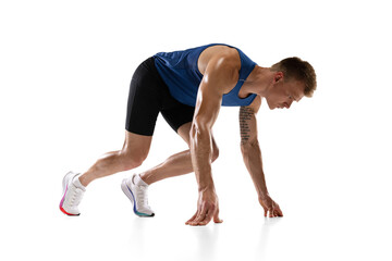 Obraz premium Caucasian professional male athlete, runner training isolated on white studio background. Muscular, sportive man. Concept of action, motion, youth, healthy lifestyle. Copyspace for ad.