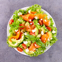 vegetable salad with smoked salmon,  tomato and avocado