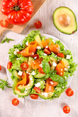 vegetable salad with smoked salmon,  tomato and avocado