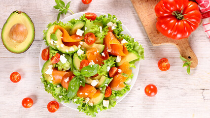 vegetable salad with smoked salmon,  tomato and avocado