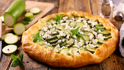zucchini tart with feta cheese and mint leaf