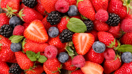 Fototapeta premium fresh berries fruits background assortment