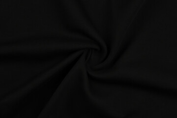 Background from black monochrome cotton fabric. Close up texture of the fabric is useful as a background.