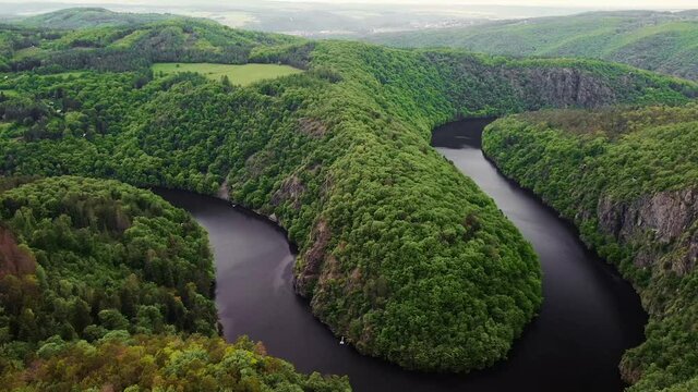 Aerial top view of natural canyon Vltava river like a horseshoe shape from Maj viewpoint.