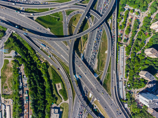 Busy multilevel junction in summer in outskirts